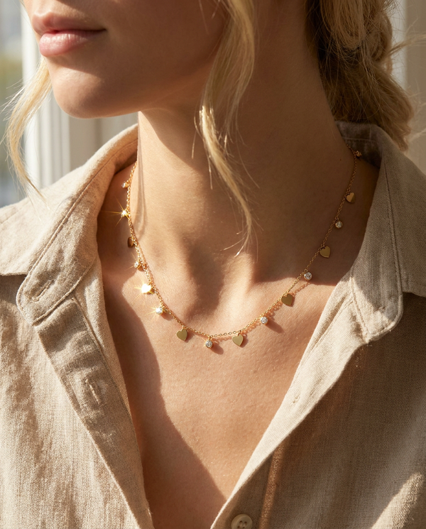 Romy heart charm necklace worn