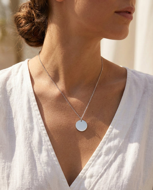 Saint coin pendant worn