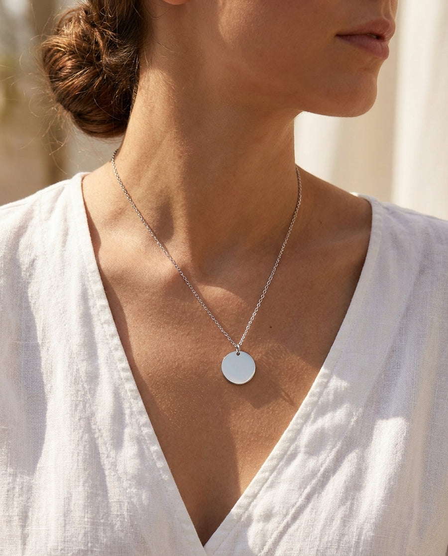 Saint coin pendant