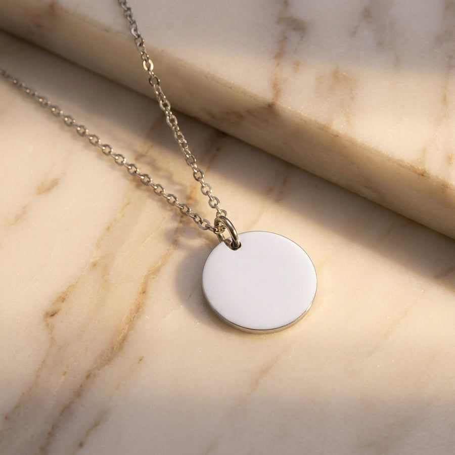 Saint coin pendant